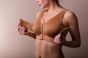 Woman compression bra, healing from breast reconstruction surgery